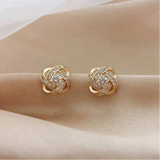 Pendientes en espiral floral dorados con cristales