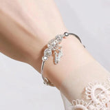 Pulsera de Plata Rígida con Diseño de Atrapa Sueños