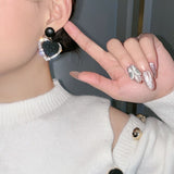 Pendientes de Corazón Negro en Oro Amarillo