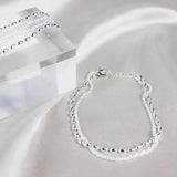 Conjunto de pulseras de plata elegantes con piedras de zirconia