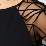 Bellezza Vestido Negro con Mangas de Malla y Corte Holgado